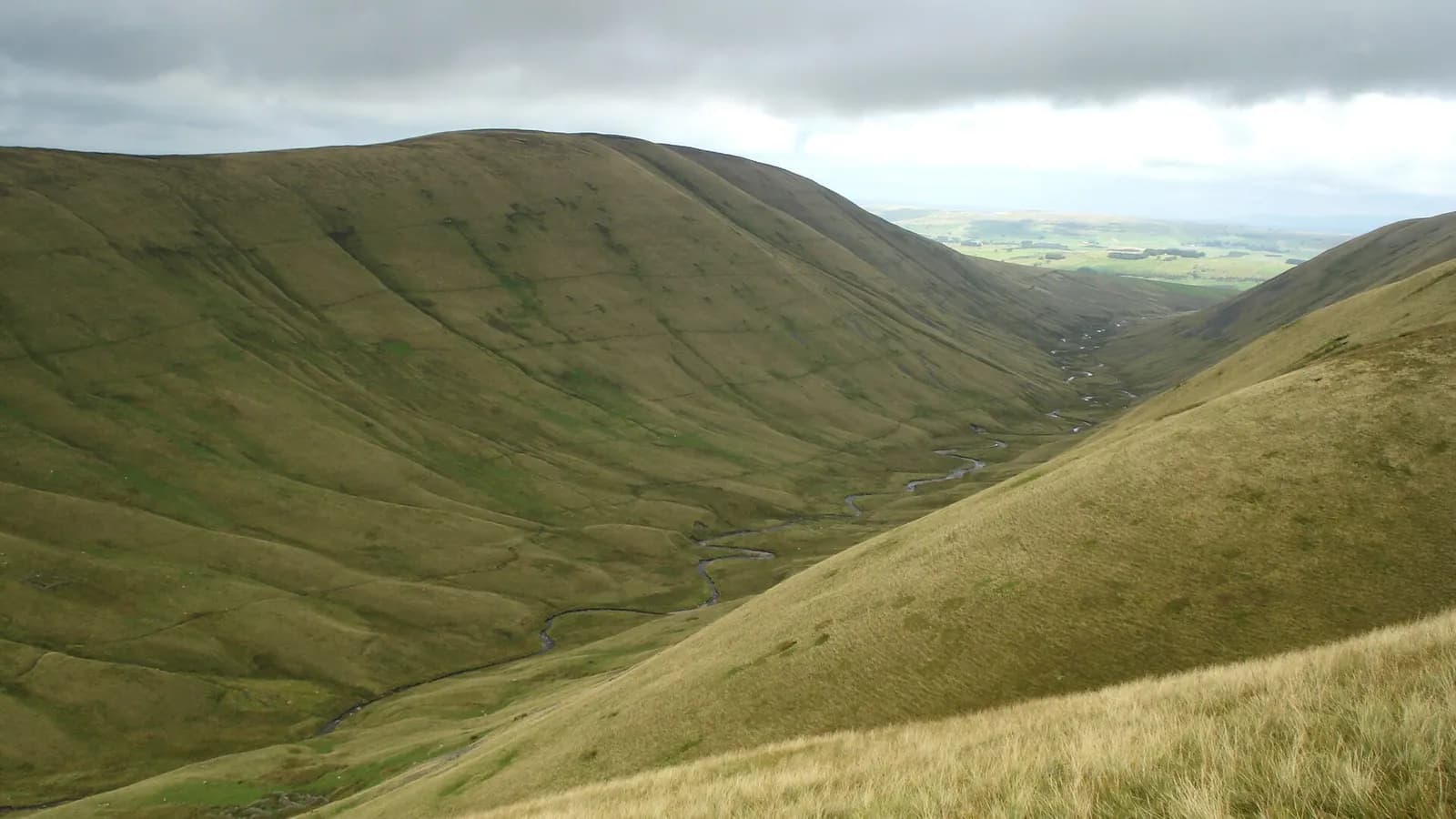 The smooth grassy slopes of Bowderdale in the Howgill Fells