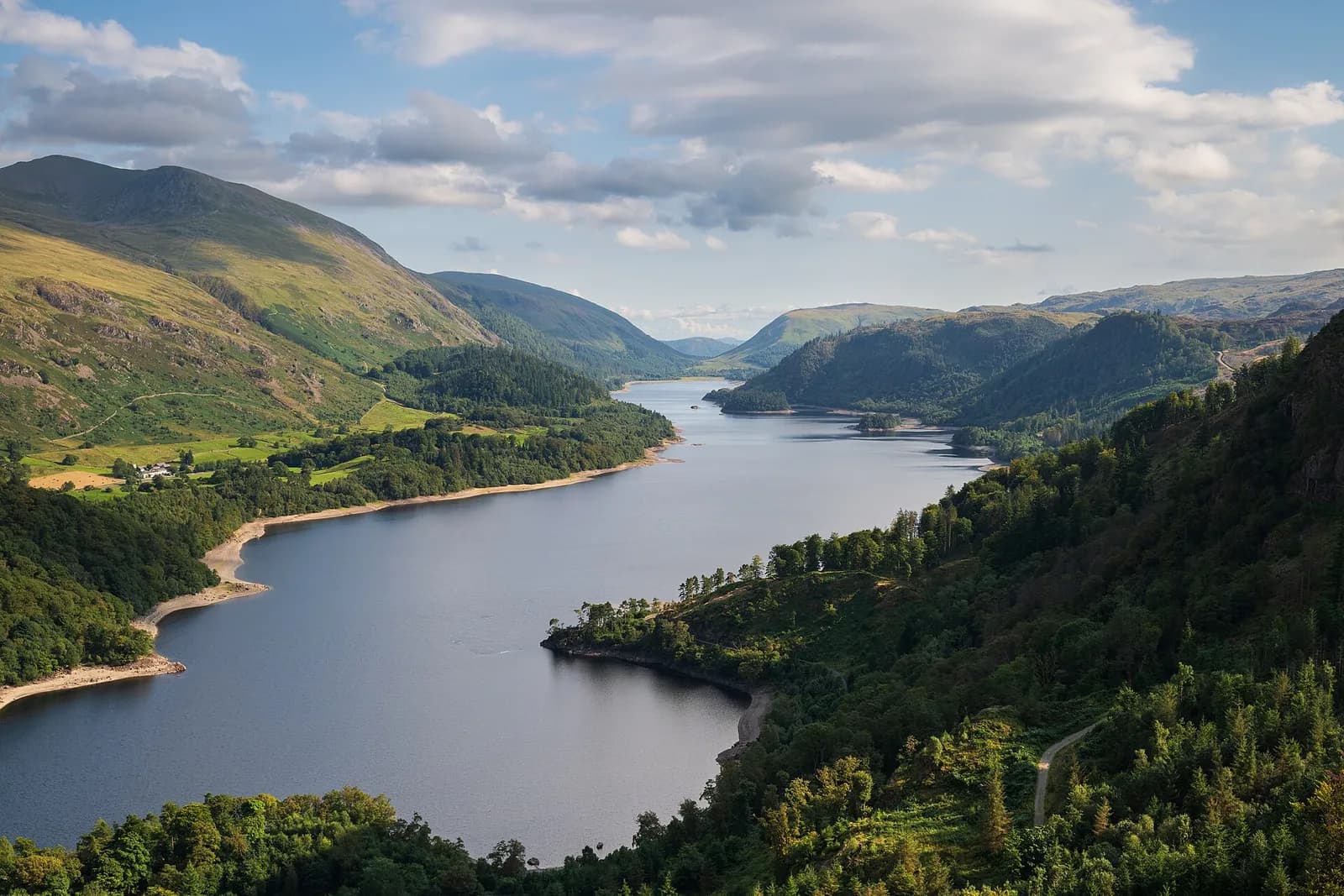 Thirlmere stretching south between wooded slopes and the Helvellyn range