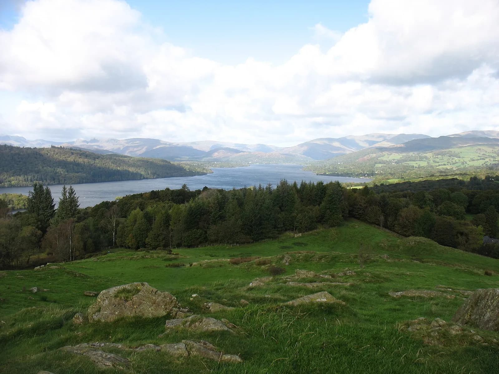 Windermere and the fells beyond from the grassy top of Brant Fell