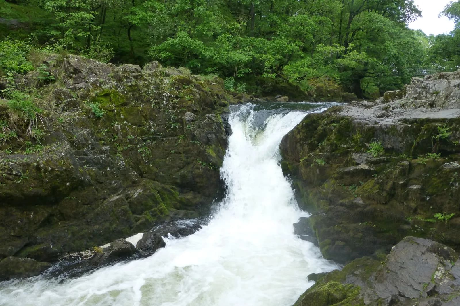 Skelwith Force pouring through a rocky cleft on the River Brathay