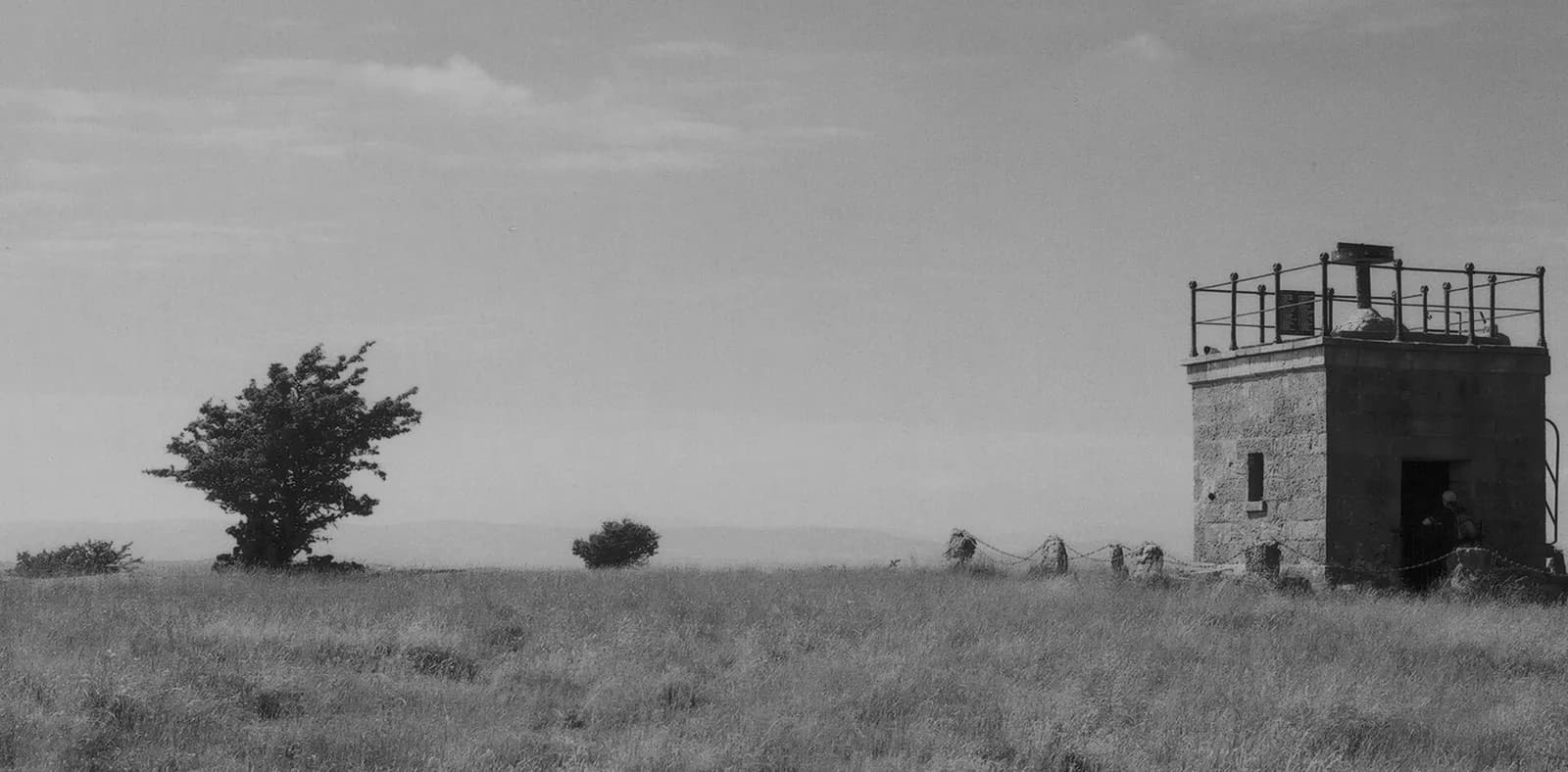 The stone Hospice on the limestone top of Hampsfell, in black and white