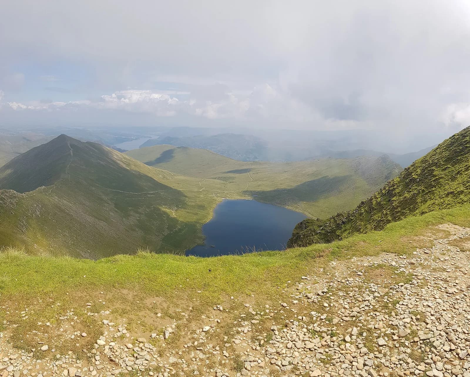 Red Tarn cupped below Helvellyn, seen from the rocky ridge above