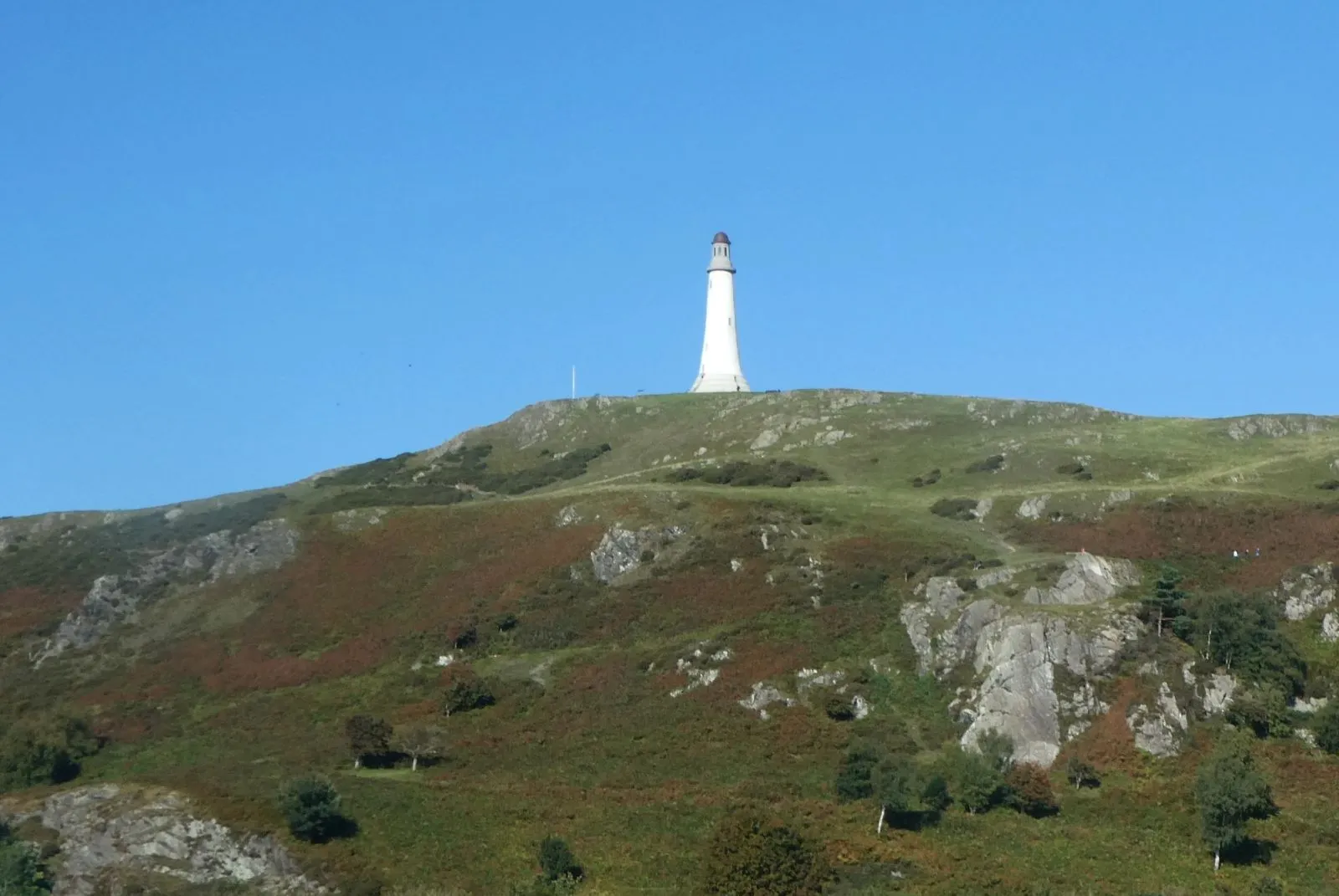 The Sir John Barrow Monument on the green top of Hoad Hill