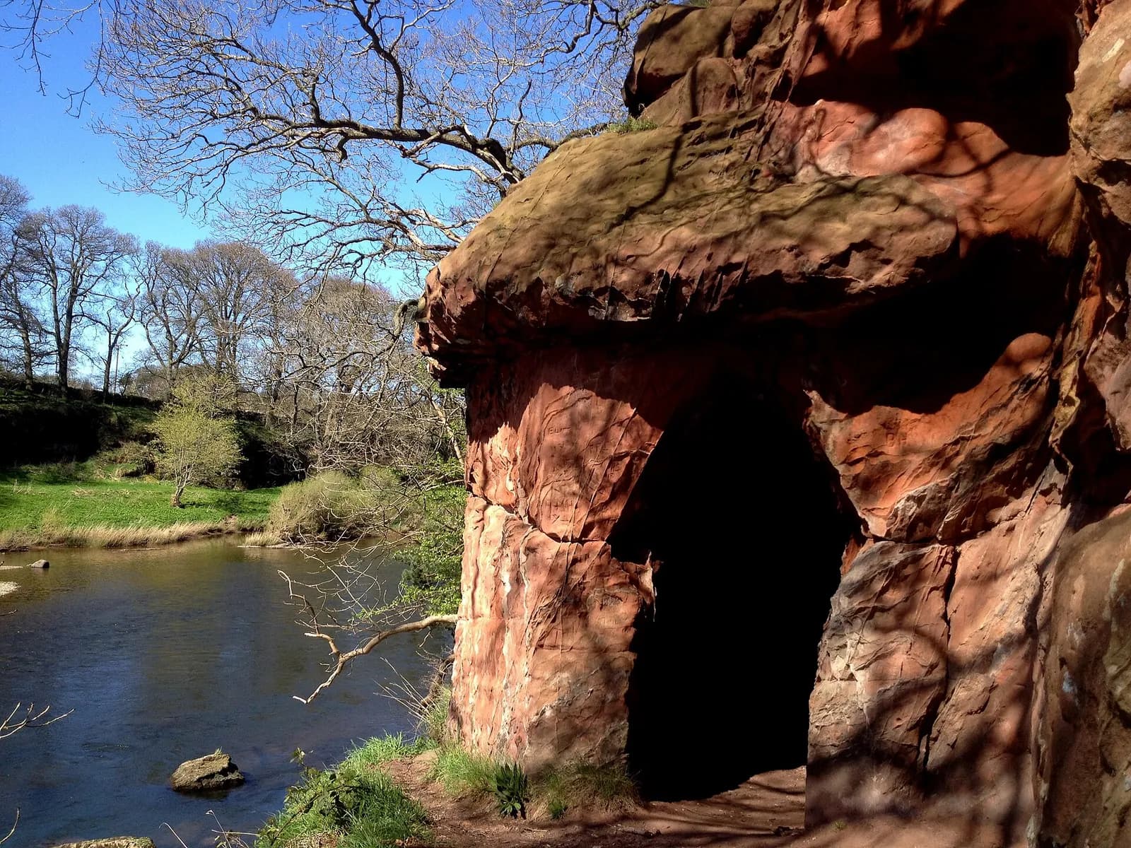 The red sandstone chambers of Lacy's Caves above the River Eden