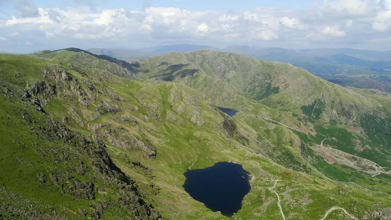 Low Water in its rocky hollow below the summit of the Old Man of Coniston