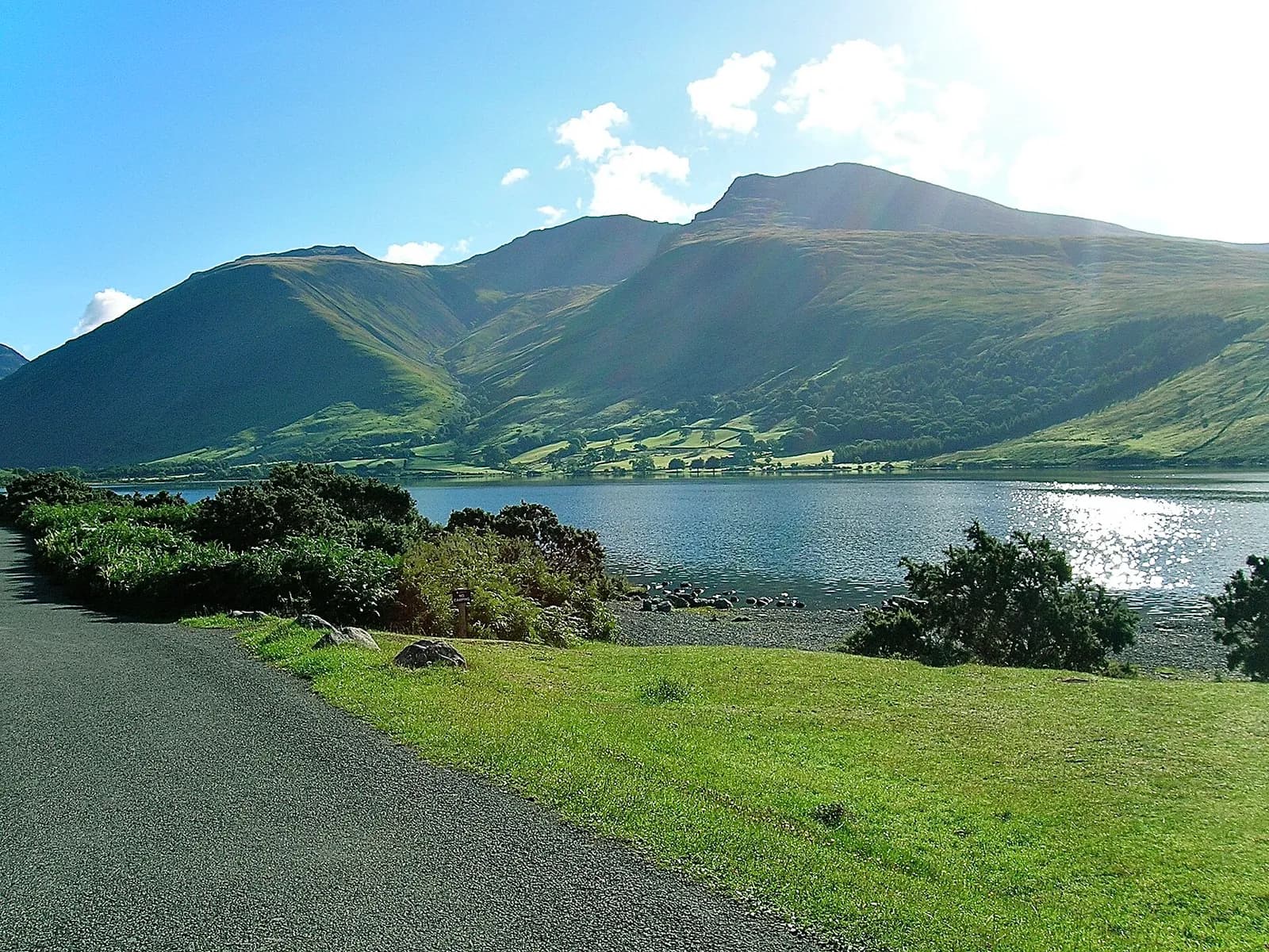 Scafell Pike rising beyond Wast Water from the lakeside road