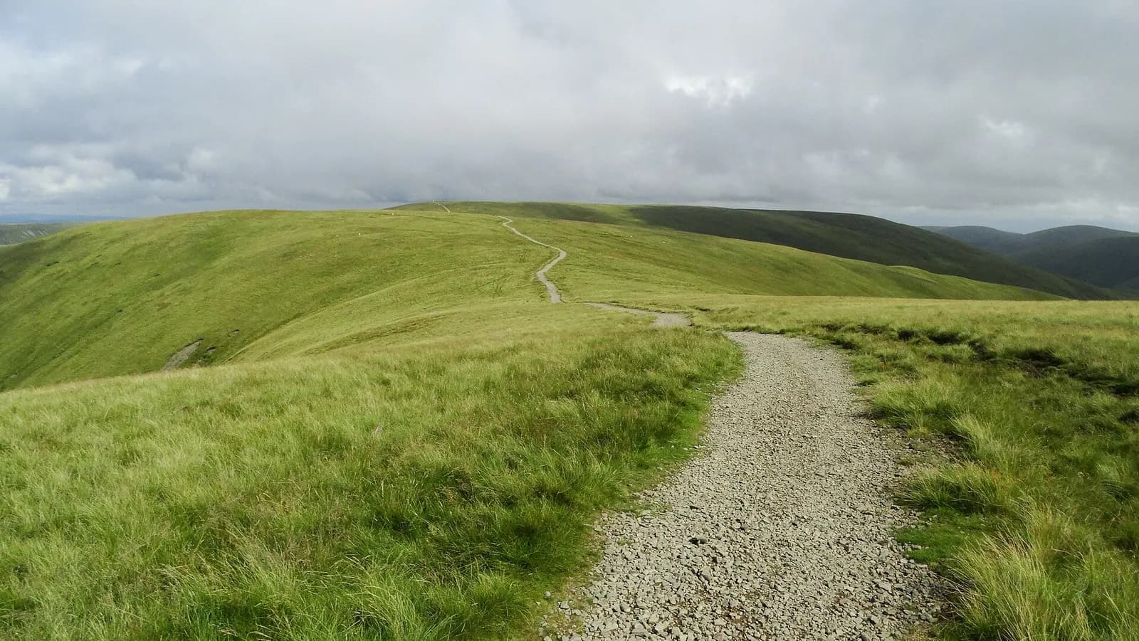The broad path from Calders towards The Calf across the rounded Howgill Fells